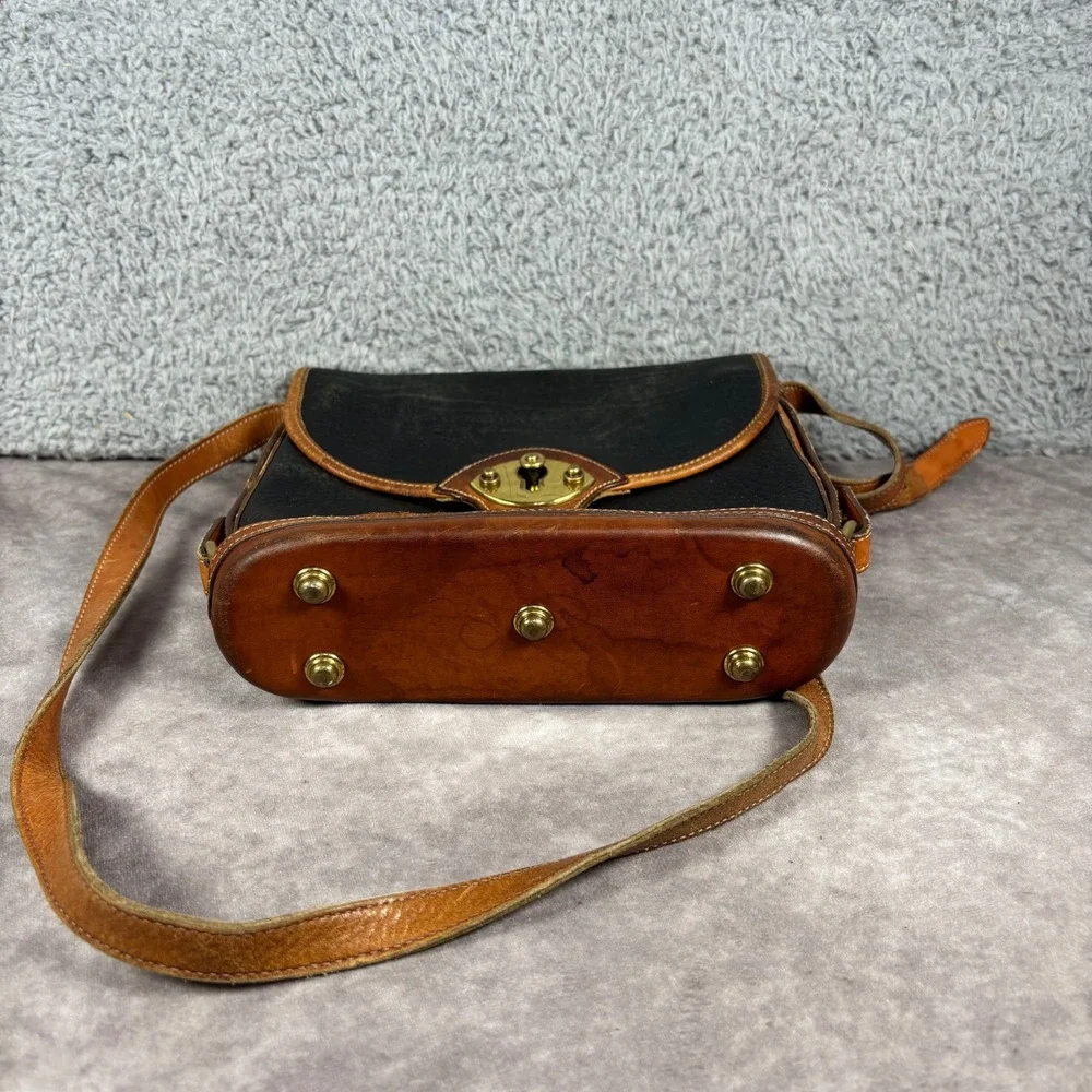 Dooney & Bourke Crossbody Bag Womens Medium Black Tan All Weather Leather Toggle